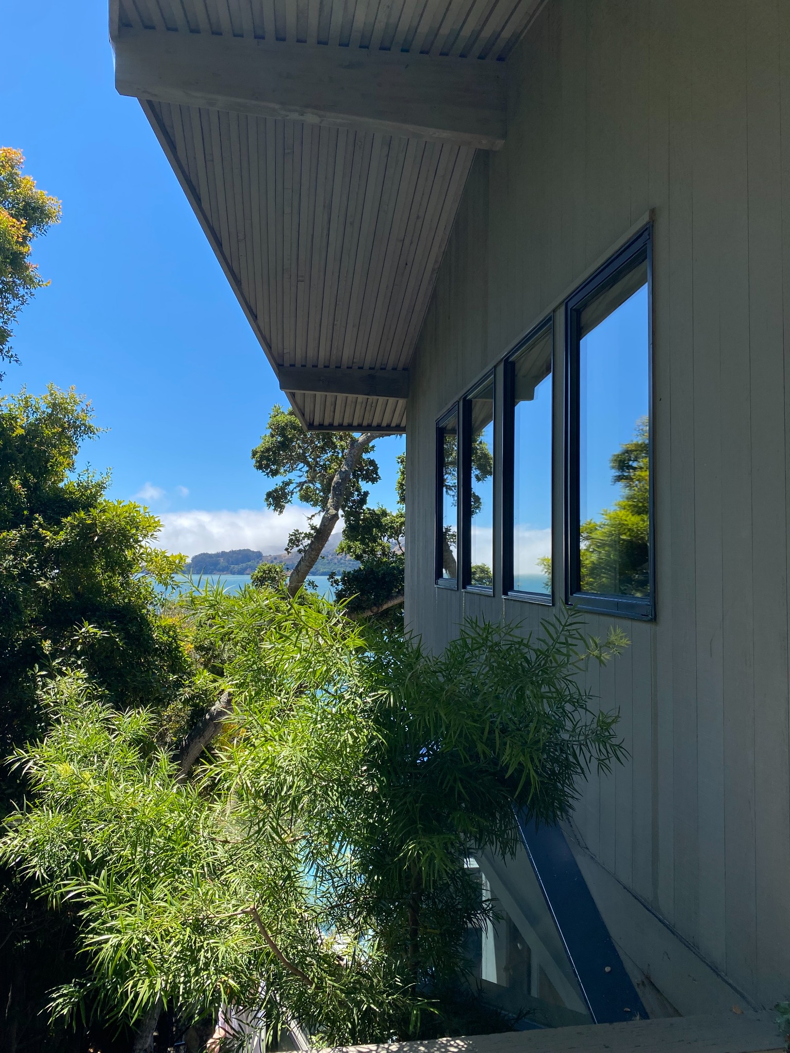 Exterior windows reflecting the blue sky after Luminal Cleaning service